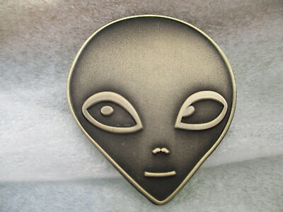 #ad Ancient Alien Grey head UFO antique brass pin.   $4.00